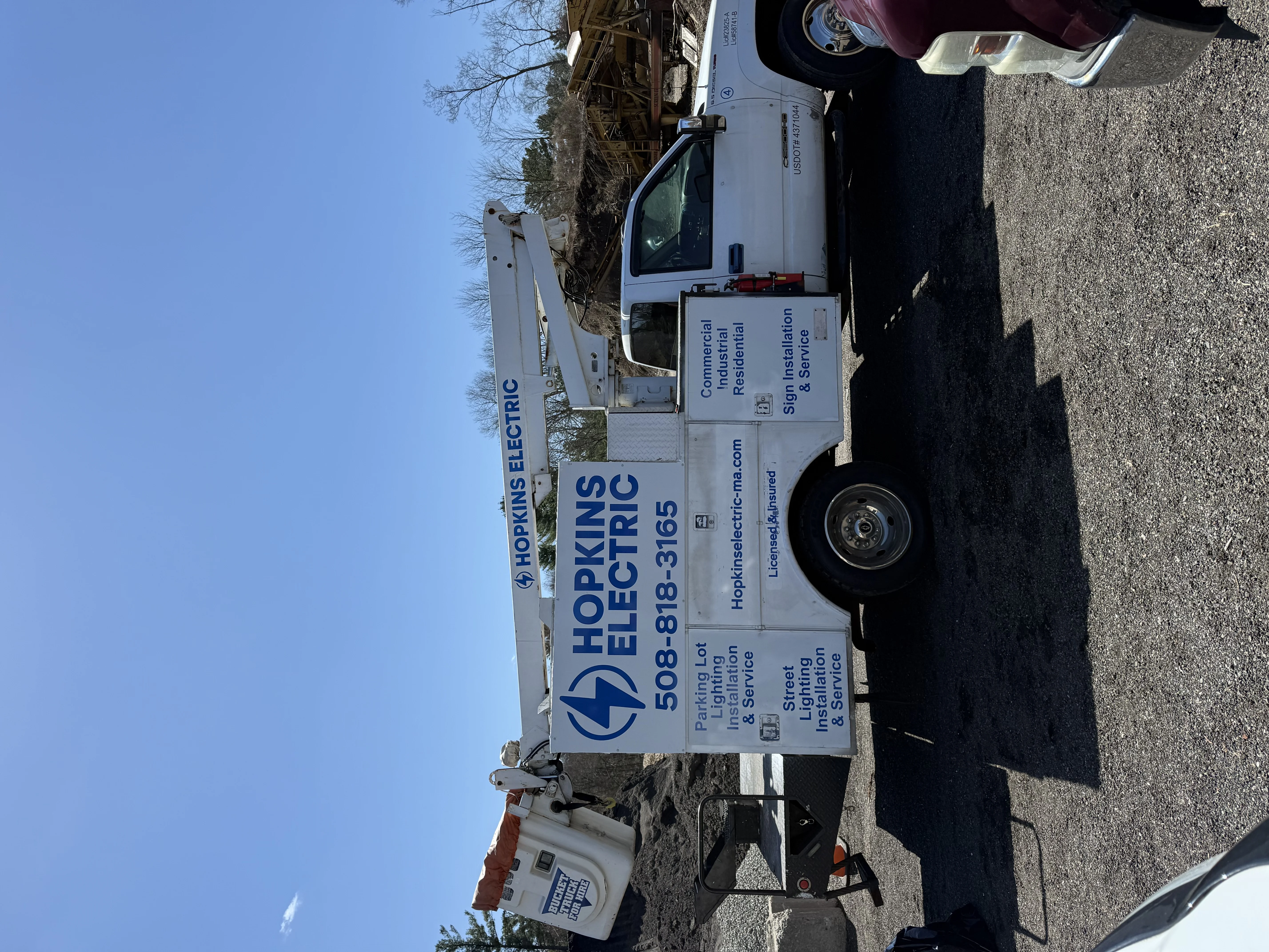 Hopkins Electric service vehicle on a mini split installation job site in Taunton, MA
